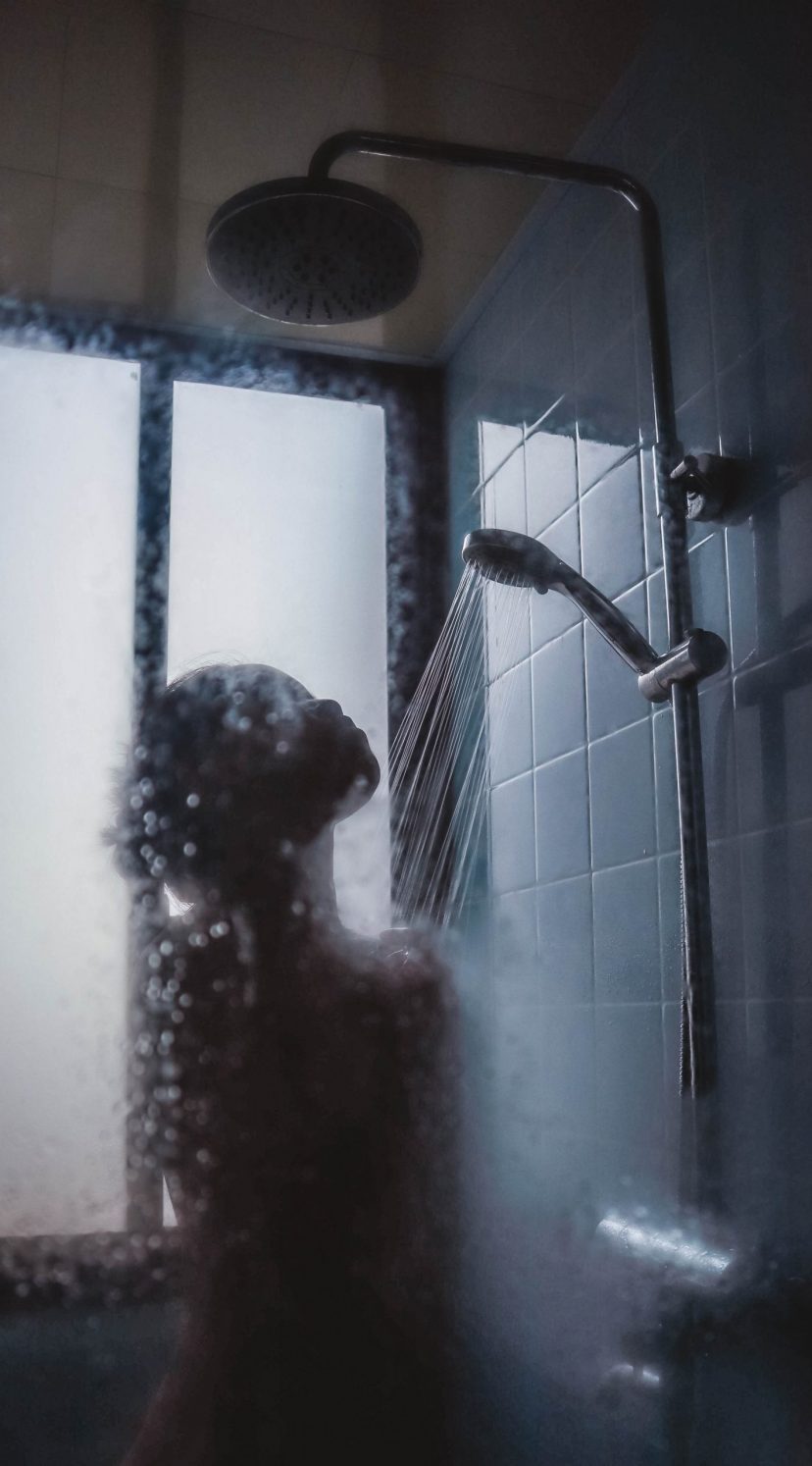 Naked girl taking a shower